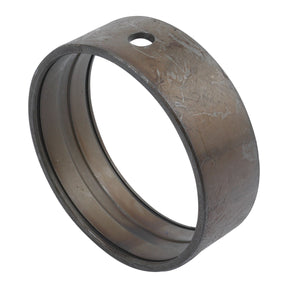 A slightly worn and scratched Sparex metal cylindrical bearing, featuring a hole on one side, suitable for Case IH Spindle Bush applications, known as the Spindle Bush | Sparex Part No.S.7721.