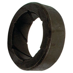 A black, cylindrical rubber bushing featuring an inner groove and a smooth outer surface, compatible with New Holland machinery. This is the Bush | Sparex Part No.S.7740 from the brand Sparex.