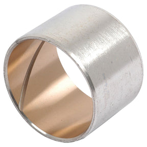 A cylindrical metal bushing with a shiny, smooth exterior and a slightly reflective inner surface, designed specifically for Ford New Holland machinery, from the Sparex brand under the name Spindle Bush | Sparex Part No. S.7762.