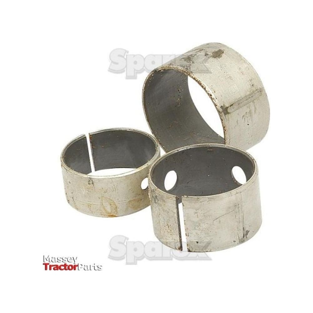 Four semi-finished metal cylindrical bushings with slits and holes, arranged in a scattered formation on a plain white background. The logo "Sparex" and the text "Massey Tractor Parts" prominently highlight these components from the Camshaft Bush Kit for engine model S.57369.