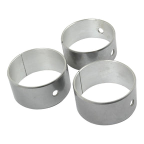Three cylindrical metal rings with small holes and slits, resembling parts from the Sparex Camshaft Bush Kit (S.62121), placed on a white background.