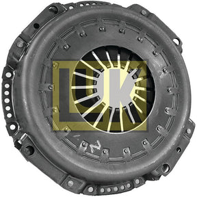 The Clutch Cover Assembly - S.145253 by Sparex features a pressed steel housing with a circular design, radial springs inside, and several holes along the edge. The component ensures reliable performance with its 310mm single cover. It displays the yellow and white "LUK" logo prominently in the center.