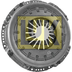 The Clutch Cover Assembly - S.145259 by Sparex features a metallic automotive clutch pressure plate with a central opening and radial spring fingers, housed in a durable pressed steel housing. The background showcases a semi-transparent "LUK" logo.