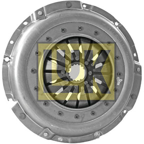 The Clutch Cover Assembly - S.145276 by Sparex showcases a meticulously detailed metal automotive clutch cover assembly featuring a circular central opening and several radially arranged spring-like components. The image also displays a yellow and black Sparex logo superimposed.