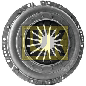 The Clutch Cover Assembly - S.145284 by Sparex is a metallic automotive clutch pressure plate featuring a central disc and radial spring fingers. The central area displays a yellow overlay with a sunburst-patterned logo and a circular cutout in the middle. This single cover plate, with an impressive size of 330mm, is secured by eight bolts.