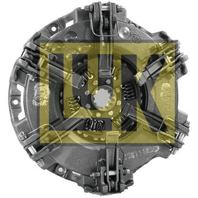 The Clutch Cover Assembly - S.145393 by Sparex includes a metallic automotive component with a cerametallic structure and boasts a large, semi-transparent yellow "LUK" logo prominently placed at the center.