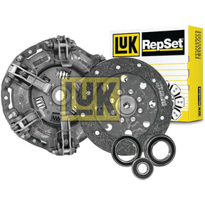 A Sparex Clutch Kit with Bearings - S.146458, including a dual cover type pressure plate, an organic material clutch disc, and release bearings, is displayed in front of its branded packaging. Ideal for Ford/New Holland T3010.