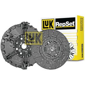 Image of a Sparex Clutch Kit without Bearings - S.131158 with a yellow and black box in the background. The kit includes a pressure plate and a clutch disc made from organic material.