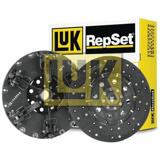 A Sparex Clutch Kit without Bearings - S.156512 displayed against a yellow and black branded box in the background. The kit, perfect for a Zetor 3320, features two metal components with numerous holes and visible springs on their surfaces.