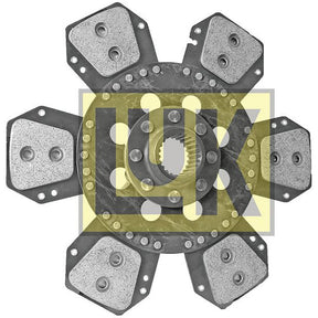 Image of a Sparex Clutch Plate - S.145835, a 310mm rigid clutch disc with a cerametallic lining, featuring six friction pads arranged in a star-like formation and bearing the LUK logo in the background.