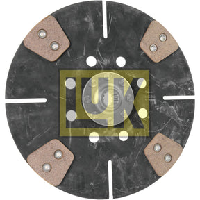 A round black clutch disc from Sparex, product number S.145845, featuring the yellow Luk logo at its center and four triangular friction pads equally spaced around the perimeter, ideal for John Deere machinery.