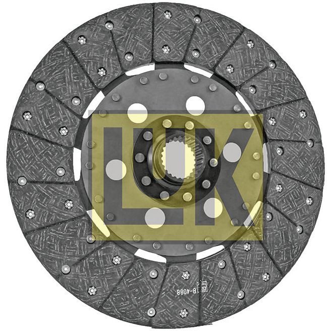 A metallic automotive clutch disc with a textured surface, featuring the "Sparex" brand logo prominently across the center. This 330mm disc is crafted with organic lining material and boasts Ford/New Holland compatibility for optimal performance. The product name is Clutch Plate - S.145902.