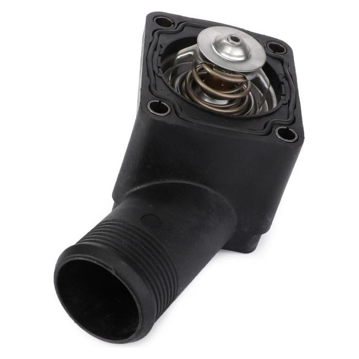 Close-up of the Massey Ferguson - Connection - 4224700M91 engine thermostat housing with a visible thermostat and spring inside a black plastic casing. Description coming soon from AGCO.