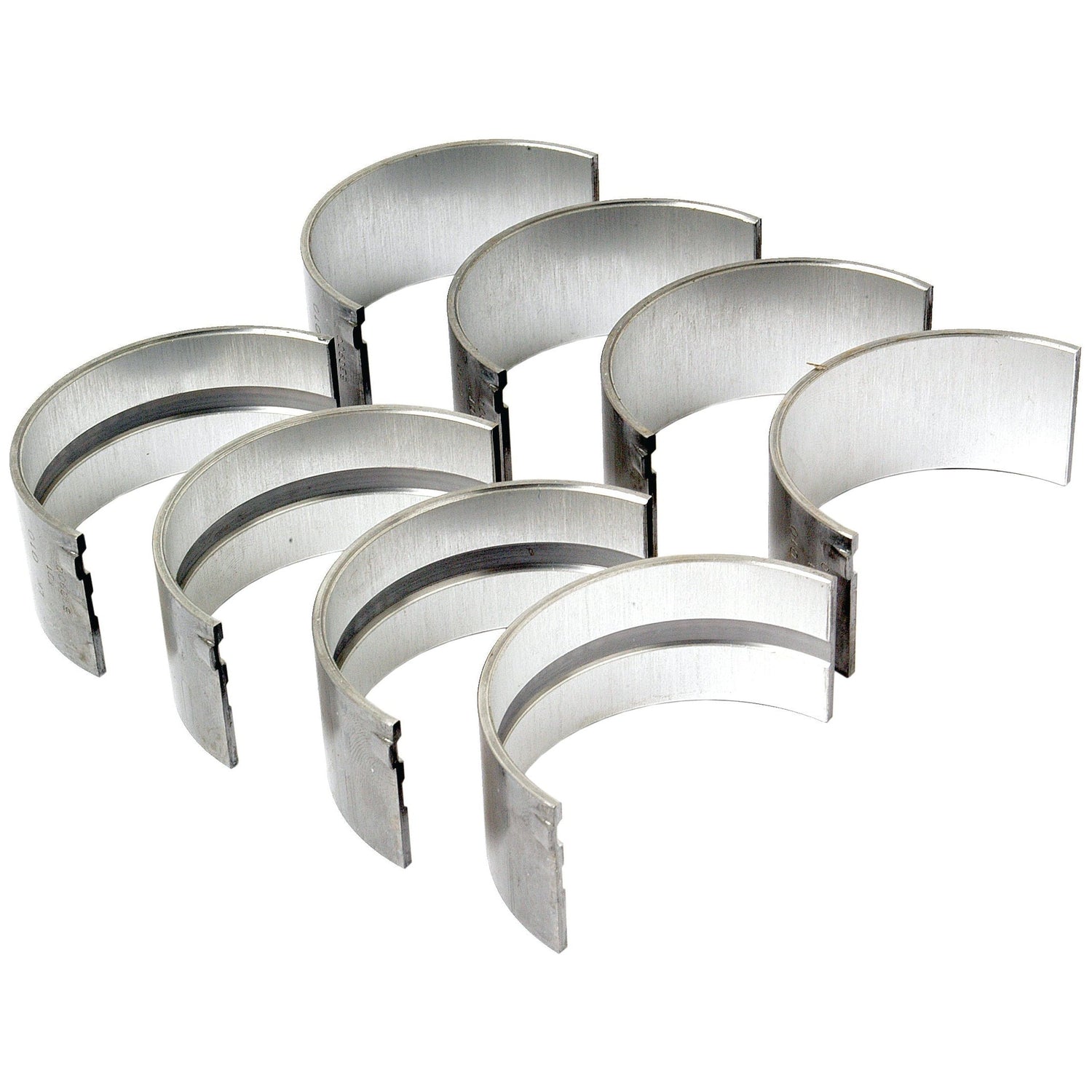 A set of seven semi-circular silver metal engine bearings, ideal for a Massey Ferguson diesel engine, arranged in two staggered rows.