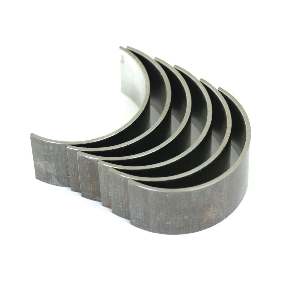 The Conrod Bearing +0.010'' (0.25mm) Set | Sparex Part No.S.57518 by Sparex consists of five curved metal bearing shells, each featuring a semi-circular shape and a polished inner surface, ideal for use in Case IH / International Harvester machinery.