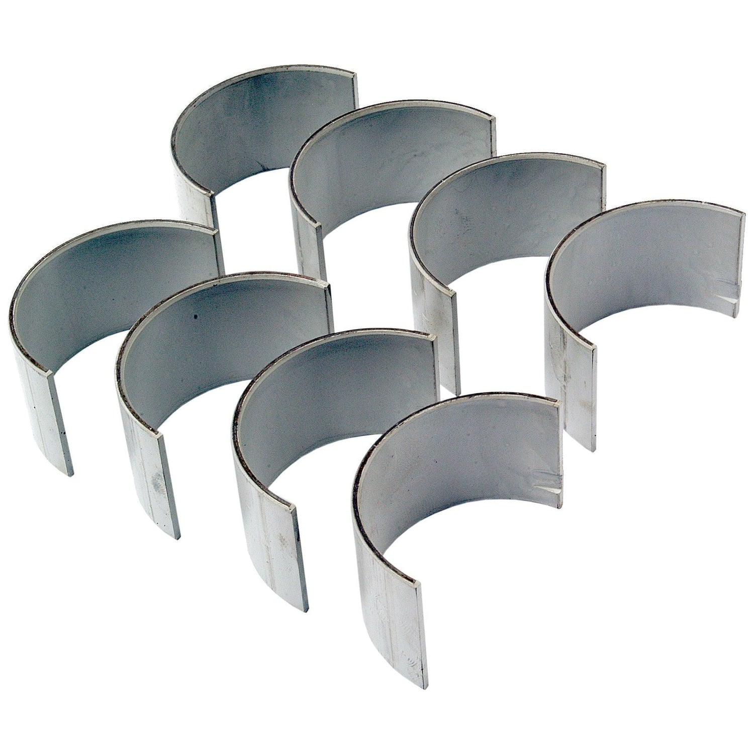 A set of eight curved metal engine bearings, specifically the Conrod Bearing +0.010'' (0.25mm) Set by Sparex (Sparex Part No.S.57651), designed for Ford / New Holland tractors and arranged in a staggered pattern.