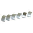 Image of six Sparex Conrod Bearing +0.010'' (0.25mm) shells, ideal for Ford tractors or compatible with New Holland equipment, lined up in a row on a white background.