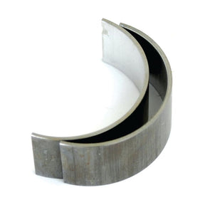 A close-up image of two semicircular metal bearing shells, resembling a Conrod Bearing +0.020'' (0.50mm) Pair | Sparex Part No.S.72109 from Sparex, placed together to form an incomplete circle.