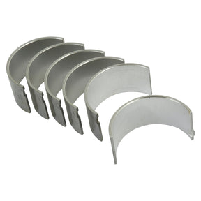 A set of six silver Conrod Bearings +0.030'' (0.75mm) from Sparex, lined up in a semi-circular formation on a white background, ready to enhance the performance of your Massey Ferguson tractor (Sparex Part No. S.40318).