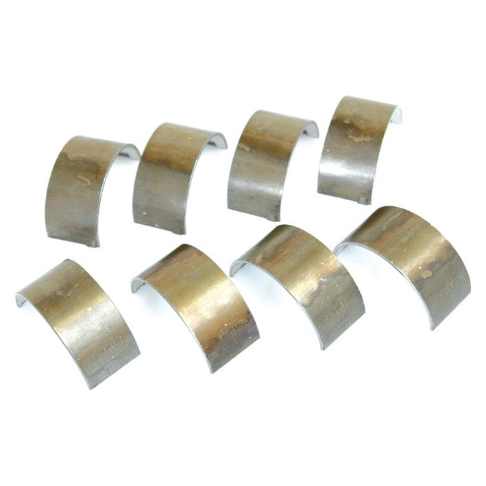 A set of eight worn, semi-circular Conrod Bearings +0.030'' (0.75mm) from Sparex, evenly spaced on a white background with the Sparex Part No.S.57646.