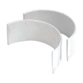 The Conrod Bearing Std. Pair (Sparex Part No.S.22499) by Sparex, consisting of two semi-circular metal bearing shells placed side by side for supporting rotating shafts in machinery, meets the precise product specifications outlined by Kubota.