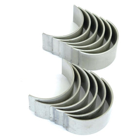 Image of multiple silver automotive engine conrod bearings, Sparex model S.66082, arranged in two curved rows facing opposite directions. Ideal for Ford New Holland engines.