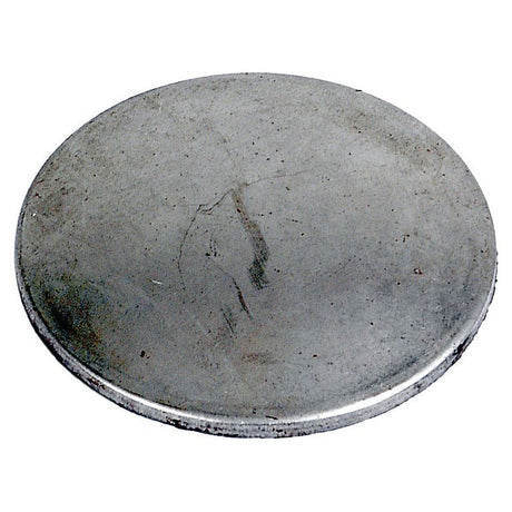 A Core Plug - 1 1/2'' (Dished Type - Mild Steel) | Sparex Part No.S.19175, featuring a slightly worn and tarnished surface.