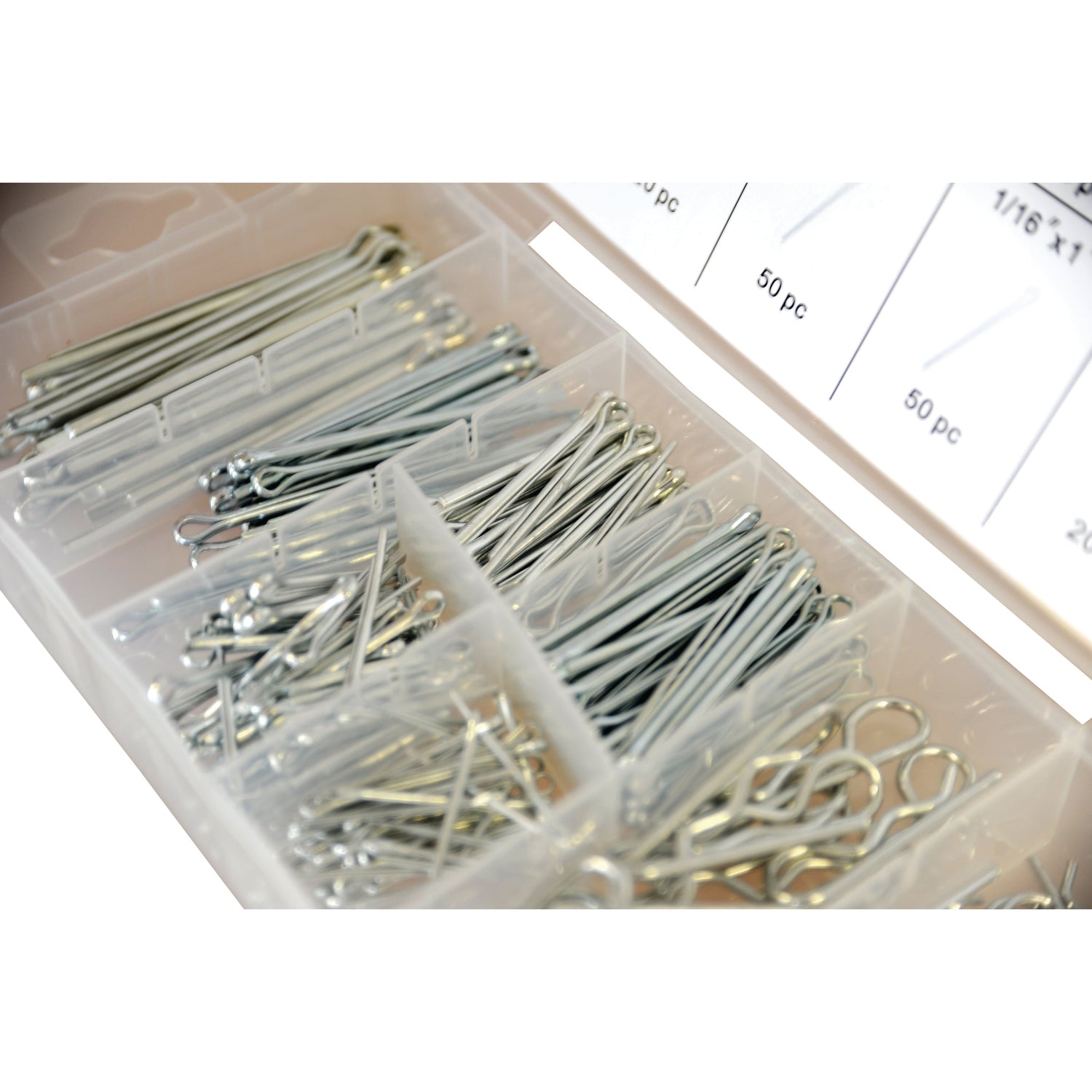 The Sparex Cotter Pins & Grip Clips Kit, Compak (260 pieces) Part No. S.29884 features a plastic organizer box filled with various sizes of steel cotter pins, each stored in separate compartments and labeled with sizes and quantities. This comprehensive kit ensures you have the right cotter pin for any job.