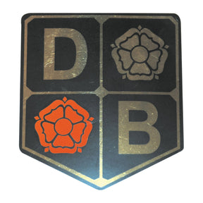 A decal from Sparex, part number S.43141, featuring an emblem divided into four quadrants with the letters "D" and "B" along with two roses—one red and one gray—in alternating sections, reminiscent of the iconic design found on David Brown products.