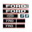 The "Decal Set - Ford / New Holland 7710 Force II" (Sparex Part No.S.12111) from Sparex includes "FORD" labels in white on black backgrounds, "7710" labels, two "II" stickers, and a small oval "FORD" badge with a red outline. This Sparex decal set is perfect for restoring your machine to its original look.