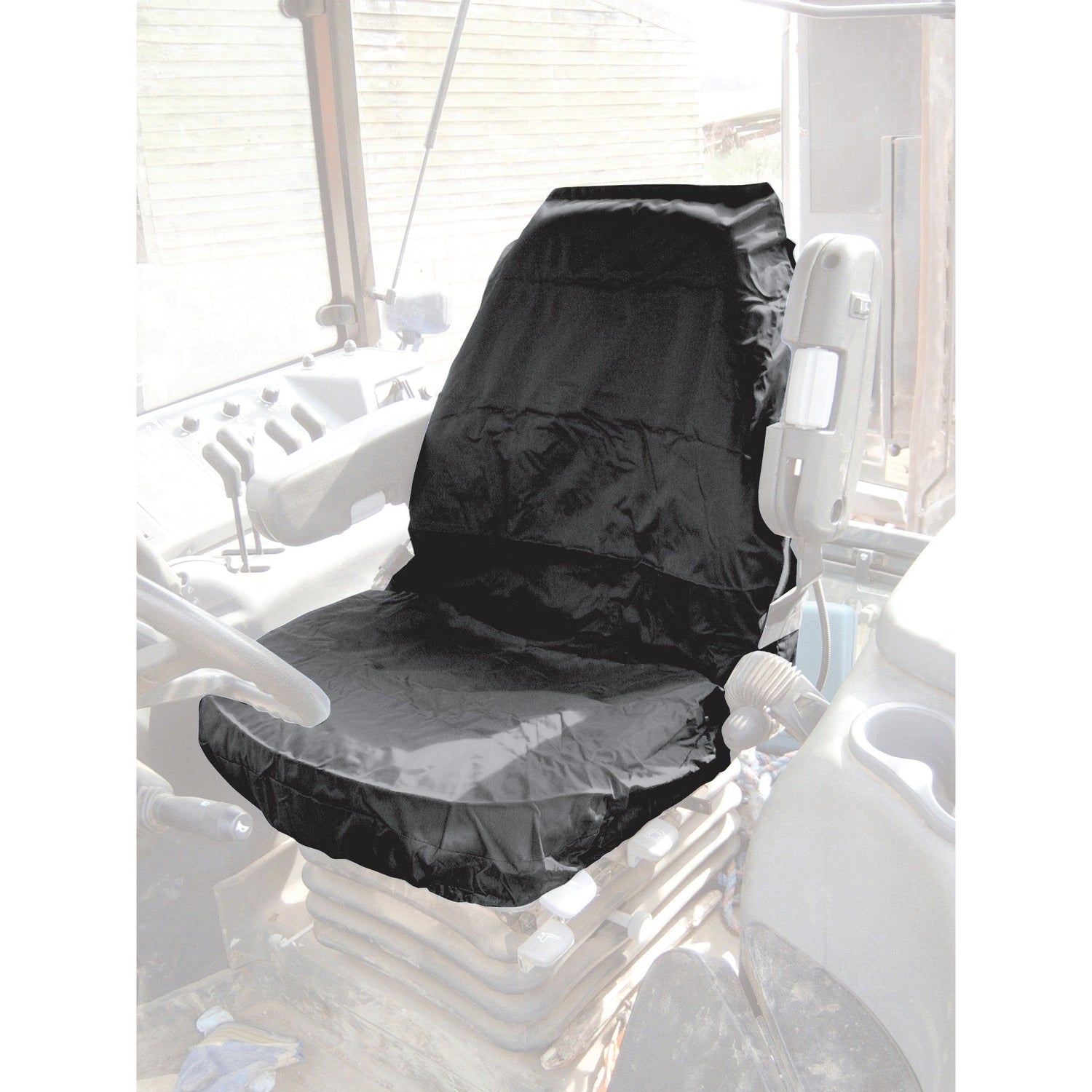 The Sparex Deluxe Seat Cover - Tractor & Plant - Universal Fit - S.71828 is installed on the driver's seat in a black finish. The control panel and steering wheel are visible in the background of the vehicle's interior.