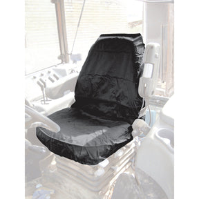 Sparex Deluxe Seat Cover - Tractor & Plant (Universal Fit - S.71828) placed on the driver's seat of a vehicle's cabin, with visible dashboard controls and steering wheel in the background. This waterproof cover offers both style and protection for your ride.