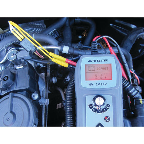 The Diagnostic test lead set - S.151759 by Sparex displays a measurement of 8.2 volts DC when connected to a car engine via its yellow and black leads. This precise reading is essential for accurate automotive diagnostics.