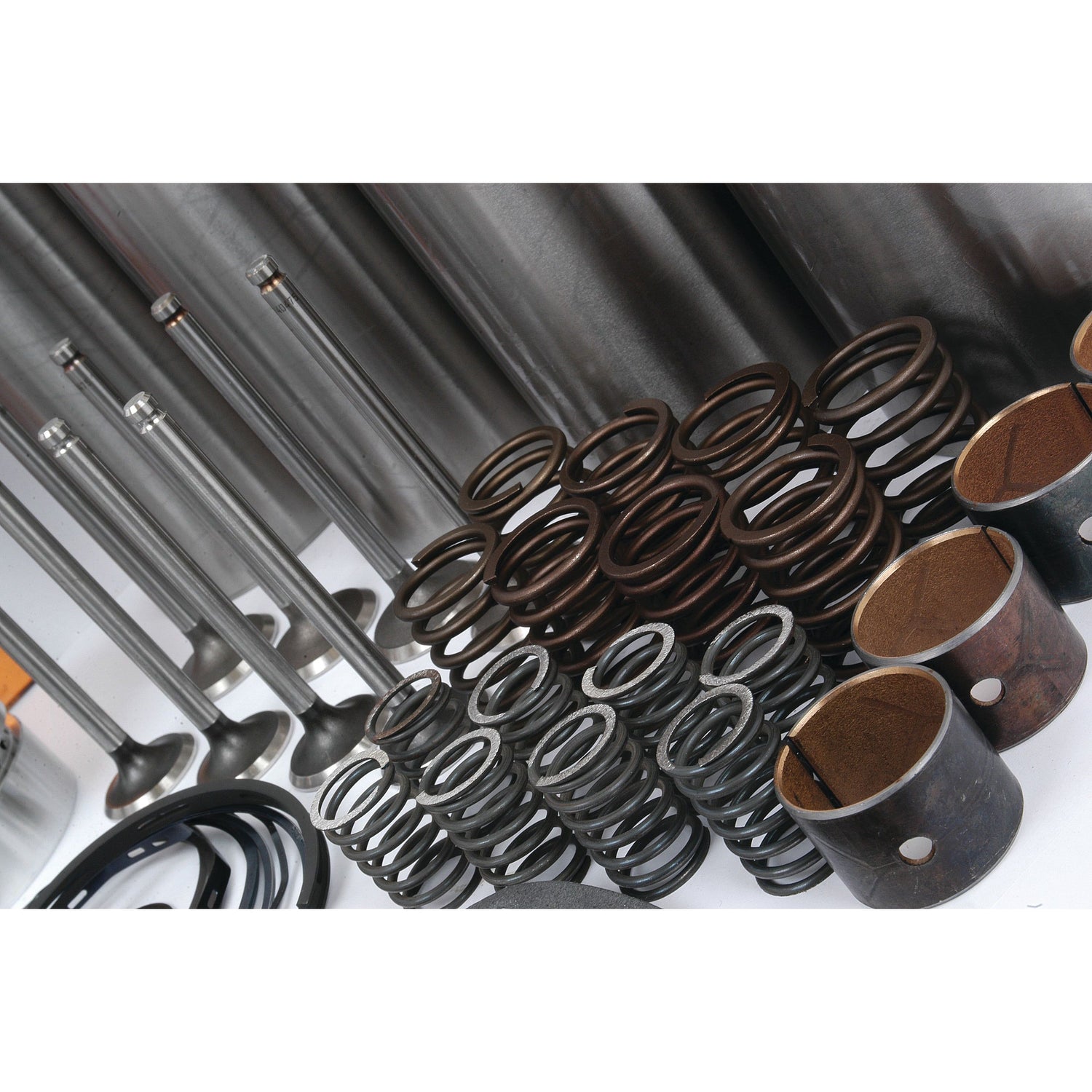 An Engine Overhaul Kit with Valve Train (Finished) - S.40371 by Sparex, featuring a collection of parts like valves, springs, seals, and other components for the Perkins Engine A4.192 Model, is neatly arranged on a white surface.