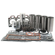 A meticulously arranged Sparex Engine Overhaul Kit with Valve Train (Finished) - S.40375, featuring pistons, cylinders, gaskets, and springs is showcased on a white background. This collection of A4.212 engine parts exemplifies precision and quality craftsmanship.