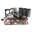 A collection of automotive engine parts, including pistons, gaskets, piston rings, and cylinder liners, perfect for a Ford engine overhaul kit - the Engine Overhaul Kit without Valve Train (Unfinished) - S.66090 from Sparex.