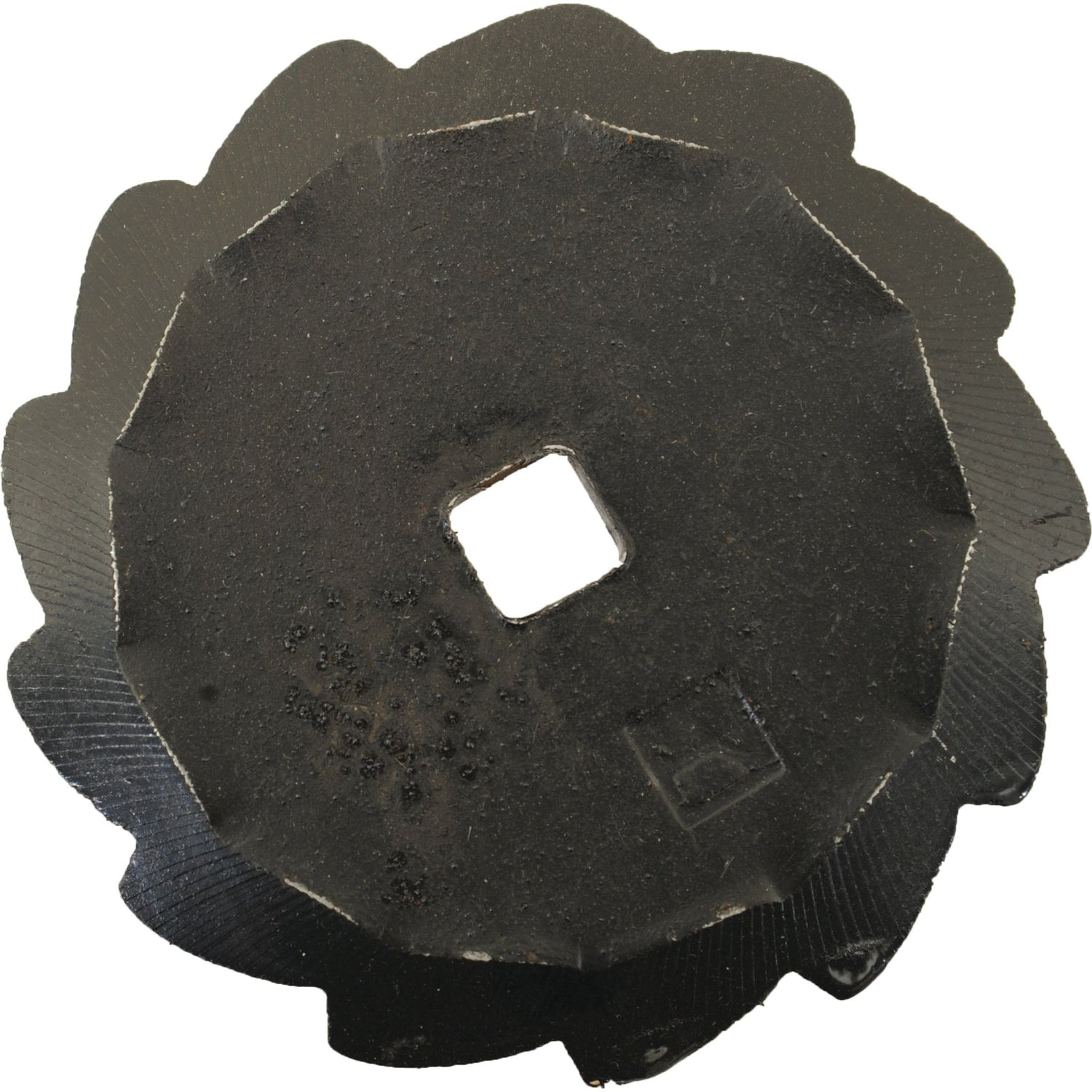 A top-view image showing a black, round metal gear with jagged edges and a square hole in the center brings to mind a Feeder Wagon Knife like the Ø94mm KD1560635 from Sparex, also known by its Sparex Part No. S.106417.