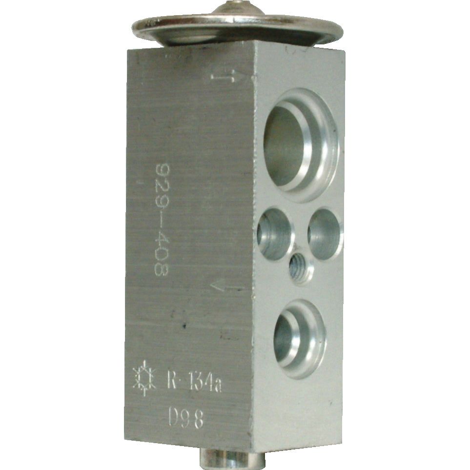 The Sparex Flare Type Expansion Valve, Sparex Part No. S.106799, is a rectangular metallic automotive part featuring several circular holes and engraved text that includes "R-134a" and an upward-pointing arrow, designed specifically for use in Ford / New Holland vehicle air conditioning systems.