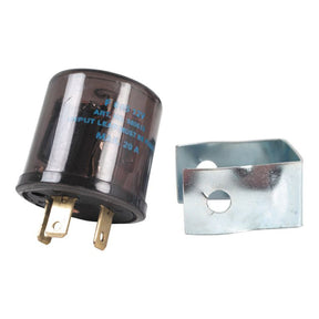 The Flasher Unit - S.26420 by Sparex is a small cylindrical electrical component equipped with metal prongs, featuring a separate metal bracket and a 3 Pole design for reliable performance.