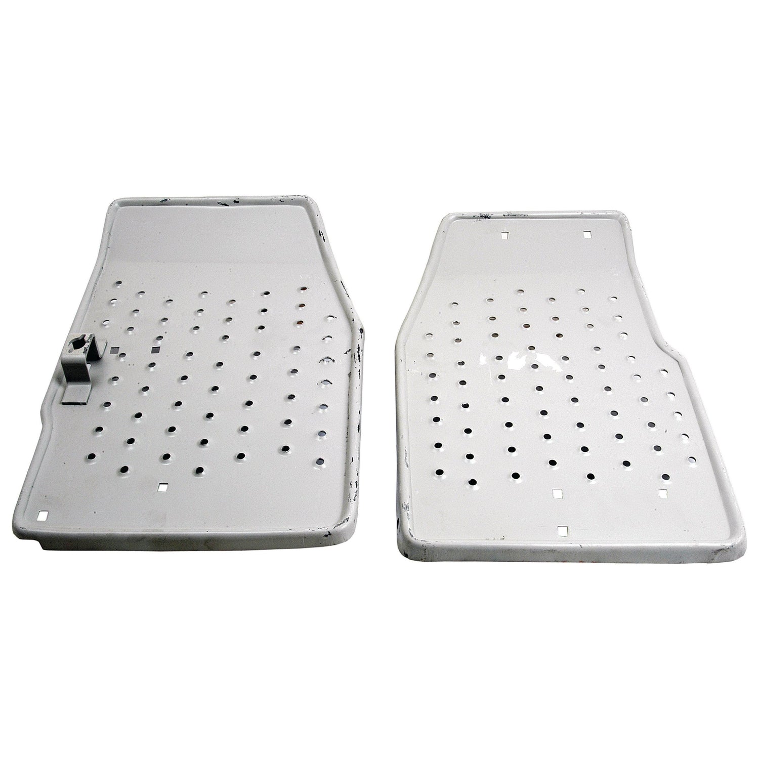 Two rectangular, white perforated plastic mats from the Footplate Set - RH & LH (Sparex Part No. S.67131) by Sparex are presented. The mat on the left features a small attached block at its top left corner. Both mats have rounded edges and are placed side by side on a plain background.