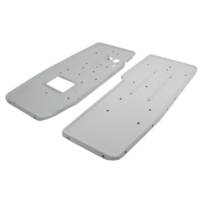 A pair of rectangular white metal plates with multiple holes and cutouts, designed for industrial or mechanical use, ideally suited as a Footplate Set for RH & LH positions in Ford/New Holland machinery. This product is known as the Footplate Set - RH & LH (Sparex Part No. S.67133) from the Sparex brand.