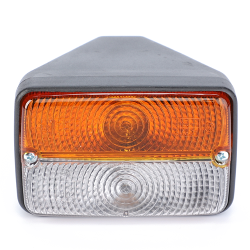 Close-up of a vehicle light featuring an amber upper section for the indicator and a clear lower section for the reverse or brake light, encased in a black rectangular housing. This vital component, known as the Massey Ferguson - Front Sidelight - 3900556M91, is part of AGCO’s 300 Series Massey Ferguson tractor parts collection, ensuring reliable signaling on the field.