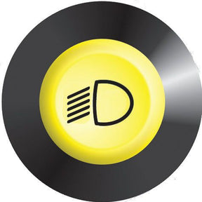 A circular yellow button with a headlight symbol, indicating a front worklight switch, is compatible with Deutz-Fahr models. It is the Front Worklight Switch by Sparex, Part No. S.52951.