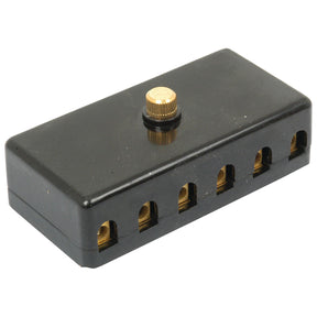 The Sparex Screw Terminal Fuse Box 6 Fuse (Part No. S.5069) is a black plastic wire connector block, resembling a compact 6 COMPARTMENT fuse box, featuring multiple slots and a single gold-colored screw on top.