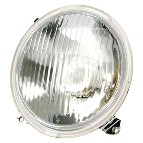 A close-up view of the round, clear headlight with a reflective surface and metal mount, featuring Sparex's E Approved halogen technology, Head Light (Halogen), LH, LH Dip, 12V - S.41109.