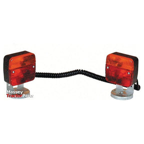 Two red and orange rear tractor lights, each featuring a halogen light source, connected by a coiled black wire with the text "Massey Tractor Parts" in the bottom left corner. This set is known as the Sparex S.5003 Lighting Set (Halogen) for 12V systems, designed to function as brake, tail, and indicator lights.