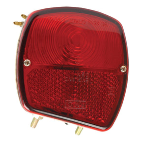 Close-up of a Sparex Rear Combination Light, model S.66735, featuring a red tail and brake light with a reflective surface and two mounting screws at the bottom. This 12V left-hand light uses halogen illumination for enhanced visibility.