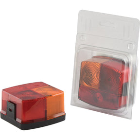 Two red and orange rectangular Rear Combination Lights from Sparex, featuring high-quality Hella halogen bulbs; one unpackaged and the other securely packaged in clear plastic. The lights support brake, tail, and indicator functions, suitable for both 12V and 24V systems - S.20051.