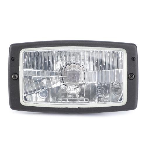 A close-up of a rectangular automotive headlight with a clear lens and a black border. Two screws are visible on either side of the frame, showcasing the AGCO Fendt Headlight (G246900020050), which is designed for optimal tractor illumination.