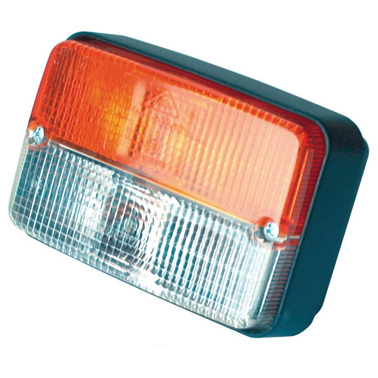 The Sparex Front Combination Light (Halogen), 12V, RH & LH, Straight - S.56139 is a rectangular vehicle tail light with an amber/clear lens featuring a halogen bulb. It has an orange top half and a clear bottom half, along with a textured surface, and is mounted on a black frame.